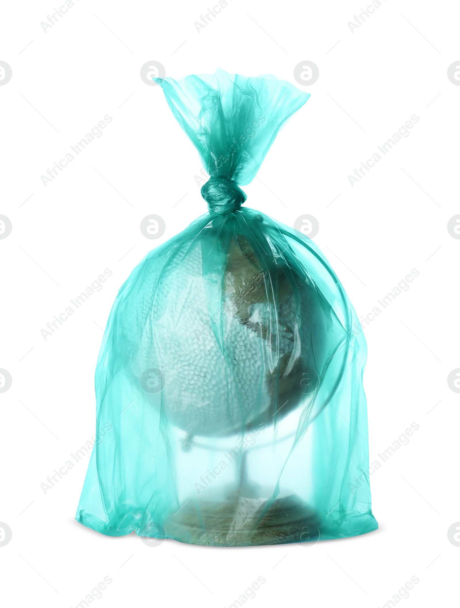 Photo of Globe in plastic bag isolated on white. Environmental conservation