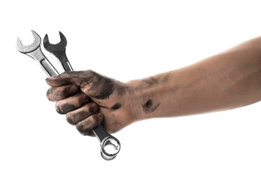 Auto mechanic holding wrenches isolated on white, closeup