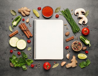 Blank recipe book and different ingredients on grey table, flat lay. Space for text