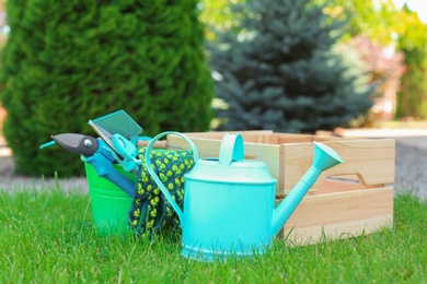 Set of gardening tools on green grass