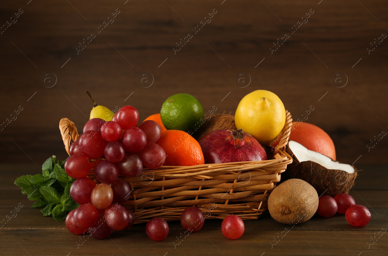 Photo of Different fresh ripe fruits on wooden table