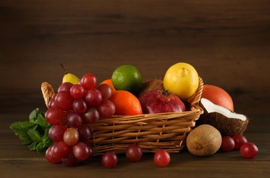 Photo of Different fresh ripe fruits on wooden table