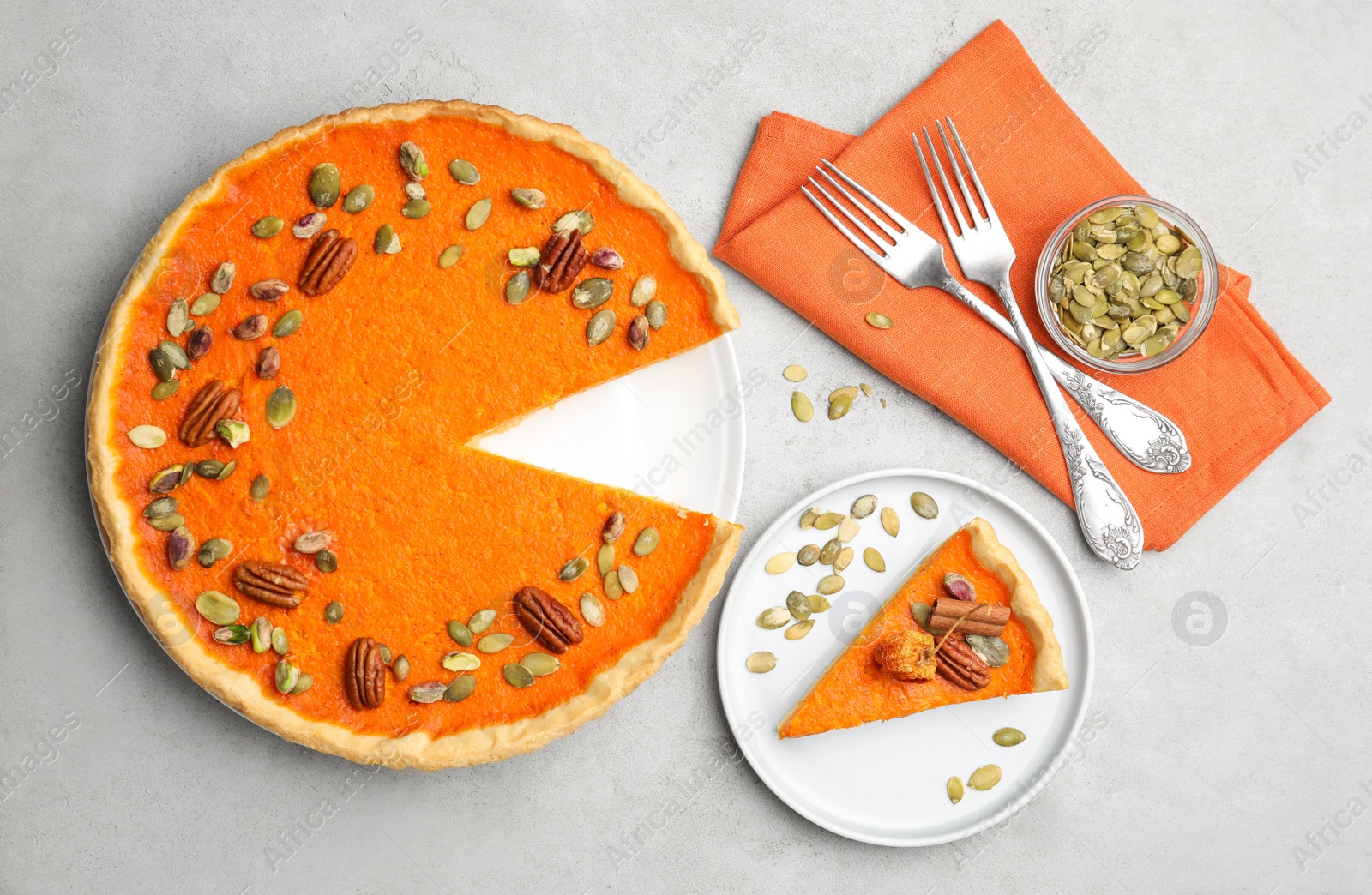 Photo of Delicious homemade pumpkin pie on light table, flat lay