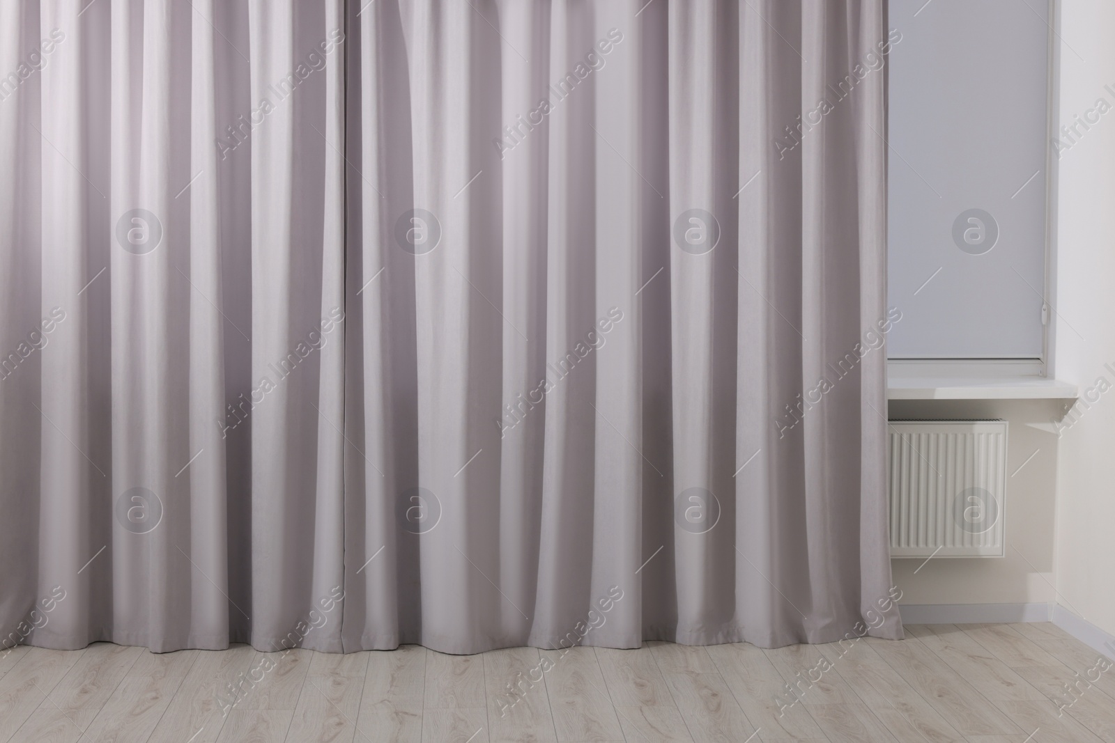 Photo of Light grey window curtains in living room