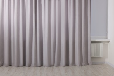 Light grey window curtains in living room