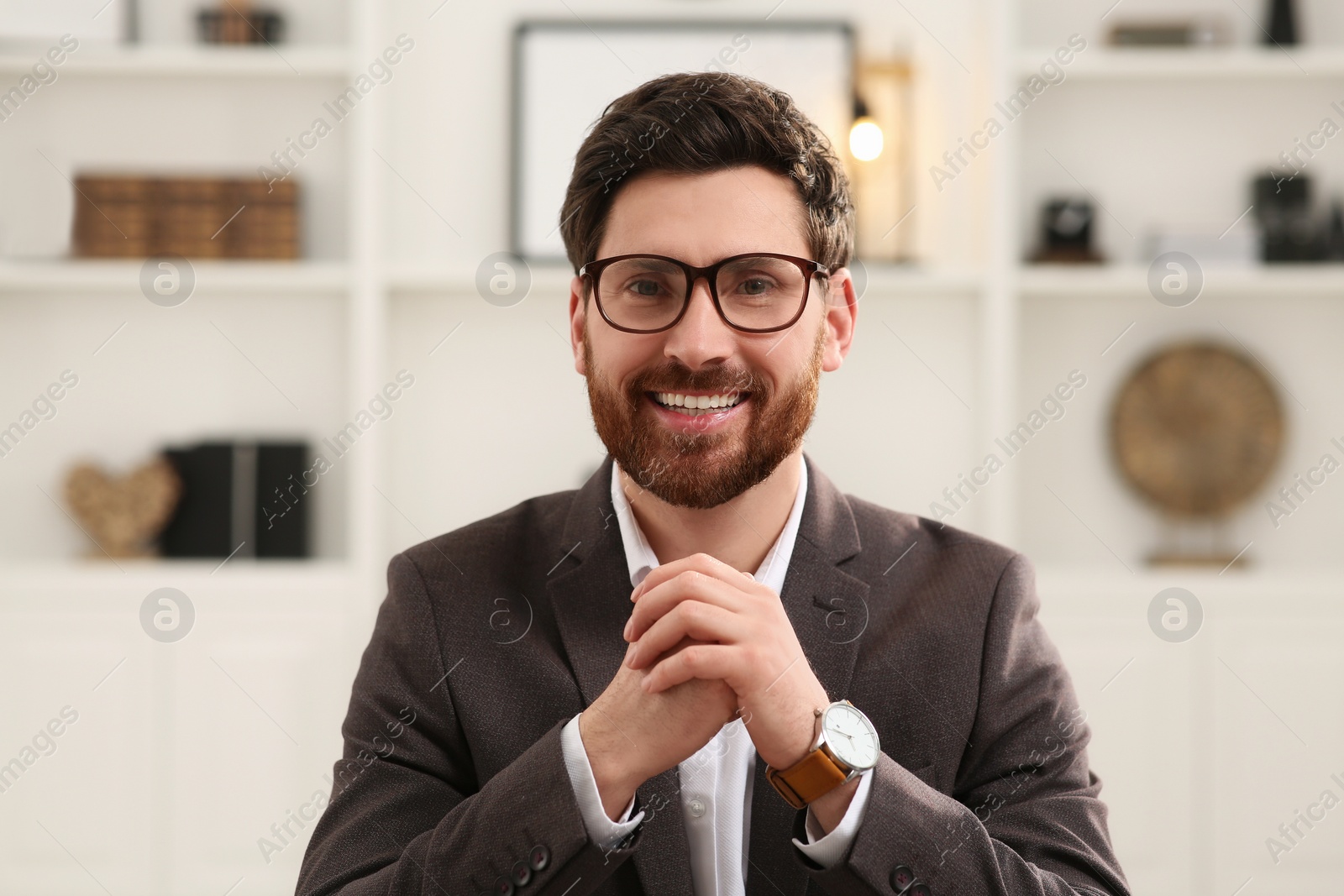 Photo of Happy businessman having online video call in office, view from web camera