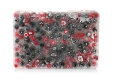 Photo of Raw berries frozen in ice cube on white background