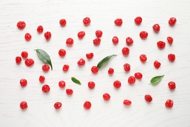 Photo of Flat lay composition with tasty cherries on wooden background. Dried fruits as healthy food