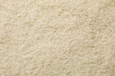 Raw basmati rice as background, top view