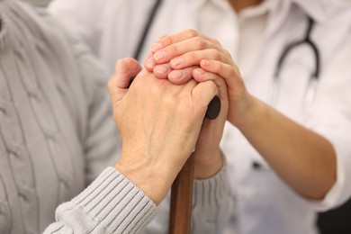 Photo of Health care and support. Nurse with elderly patient, closeup