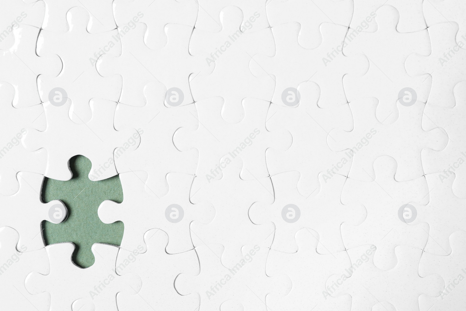 Photo of Blank white puzzle with missing piece on grey background, top view. Space for text