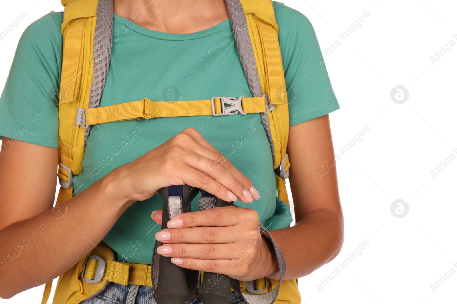 Photo of Woman with backpack and trekking poles on white background, closeup