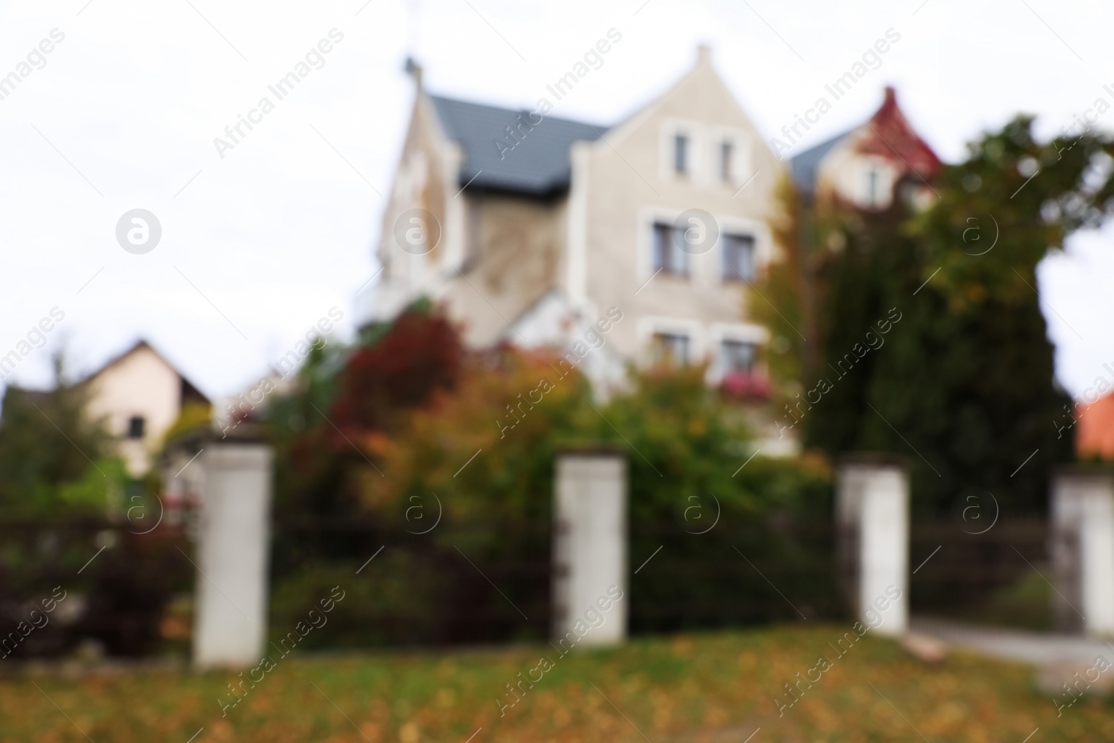 Photo of Blurred view of beautiful stylish house outdoors. Real estate for rent