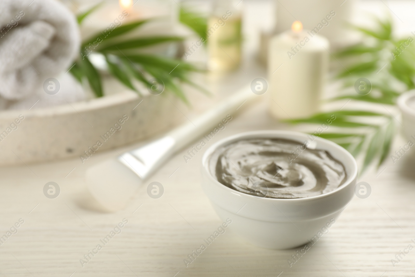 Photo of Cosmetic product for spa body wraps on white wooden background