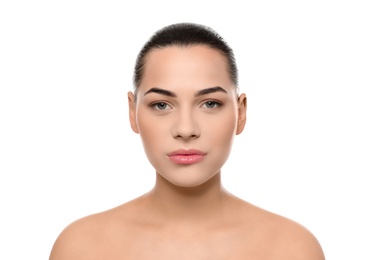 Portrait of young woman with beautiful face and natural makeup on white background