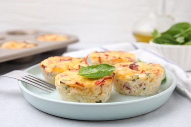 Freshly baked bacon and egg muffins with cheese served on table, closeup. Space for text