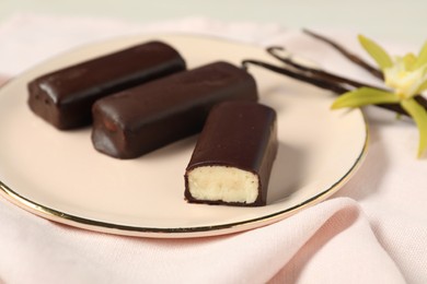 Photo of Glazed vanilla curd cheese bars served on table, closeup