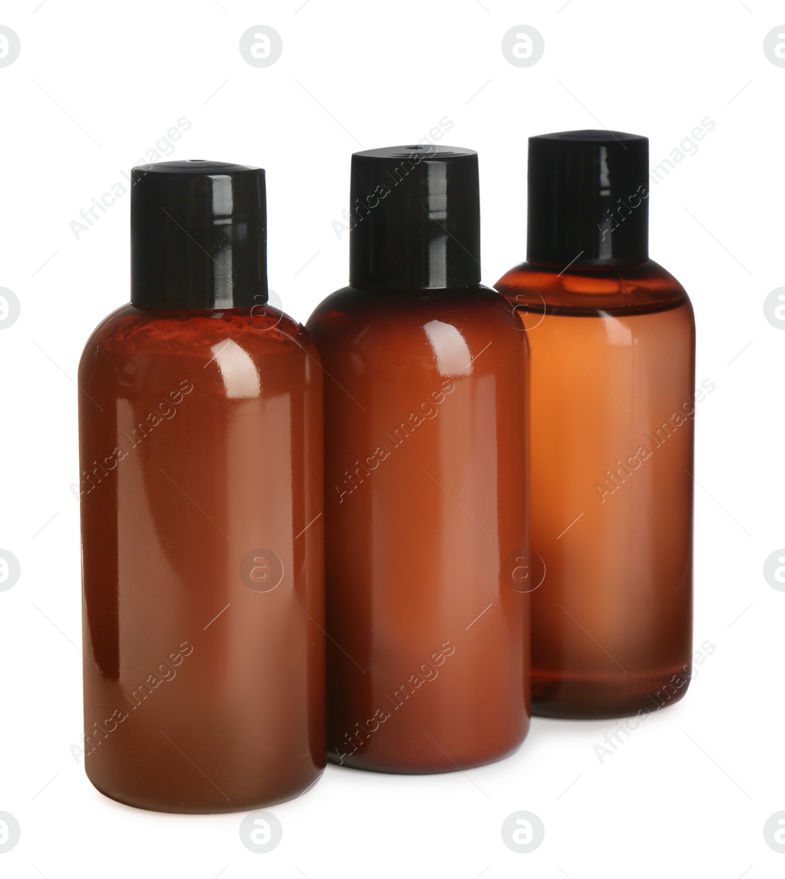 Photo of Mini bottles with cosmetic products on white background. Hotel amenities