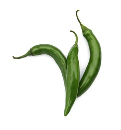 Photo of Green hot chili peppers on white background, top view