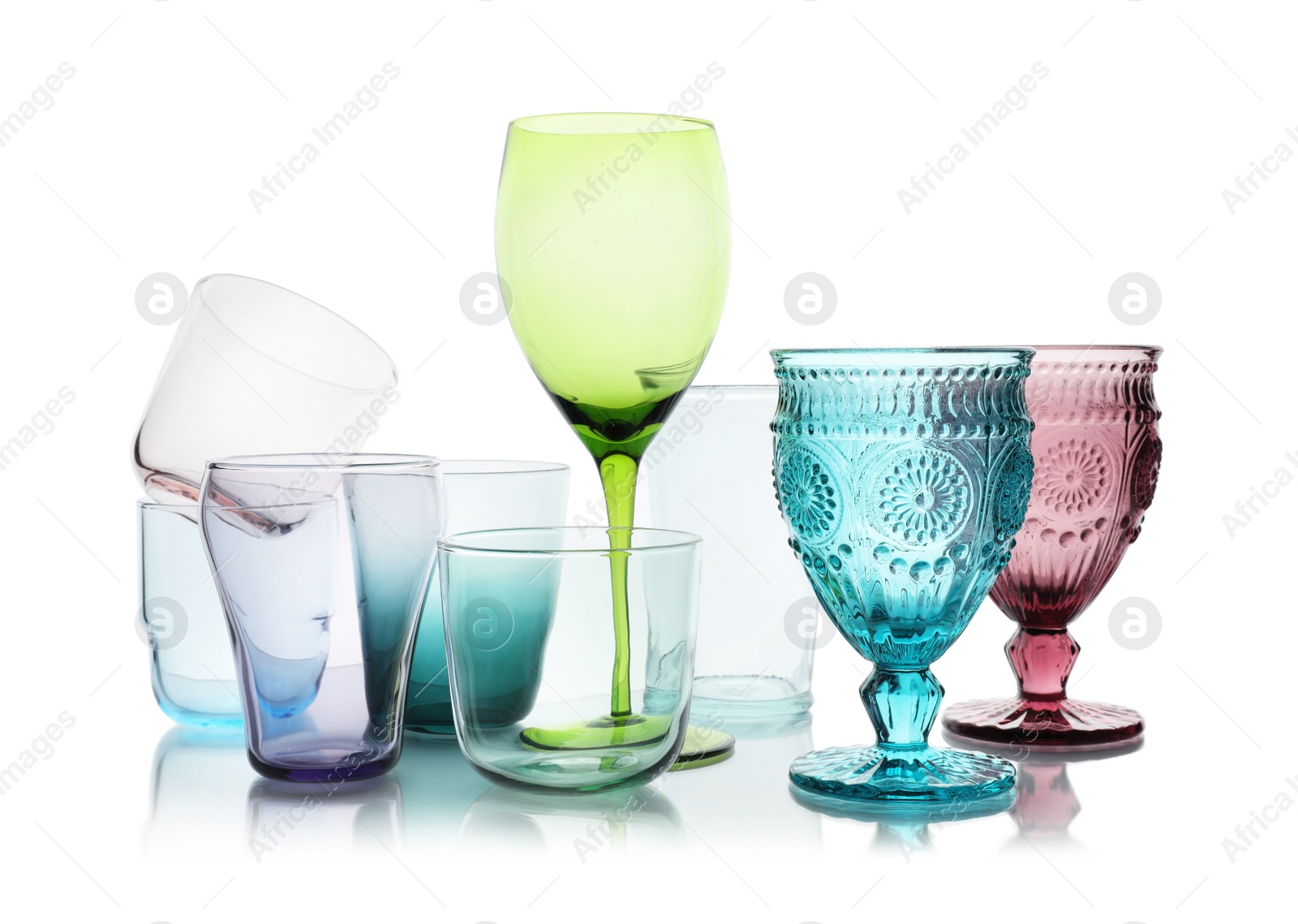 Photo of Set of different empty glasses on white background