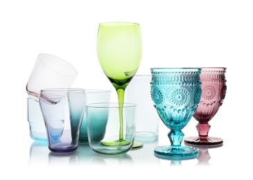 Photo of Set of different empty glasses on white background