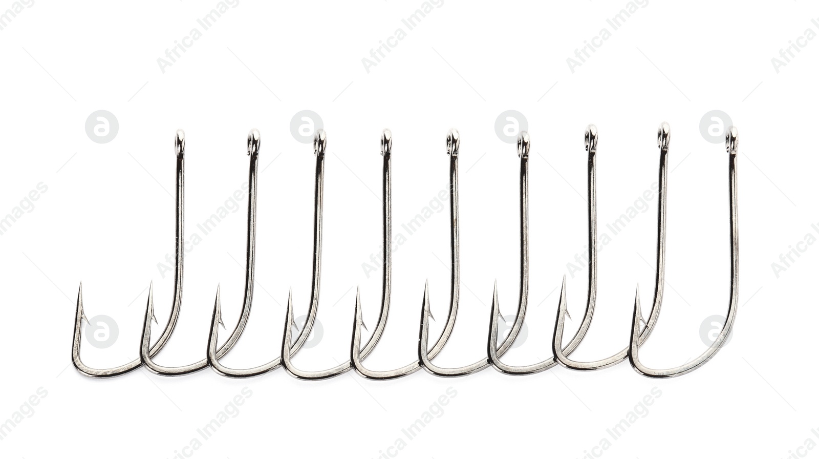 Photo of Metal hooks on white background. Fishing accessories