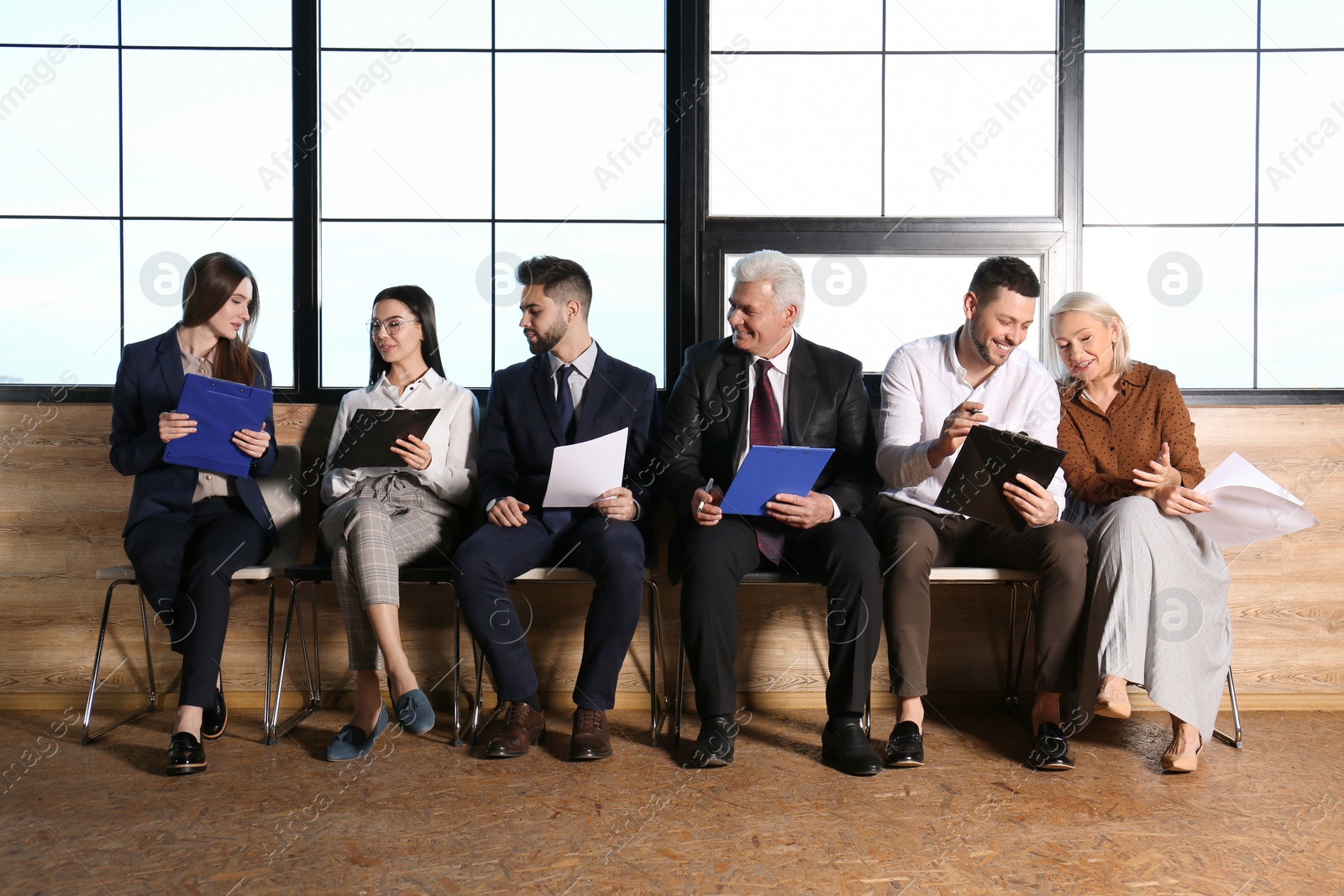 Photo of People waiting for job interview in office hall