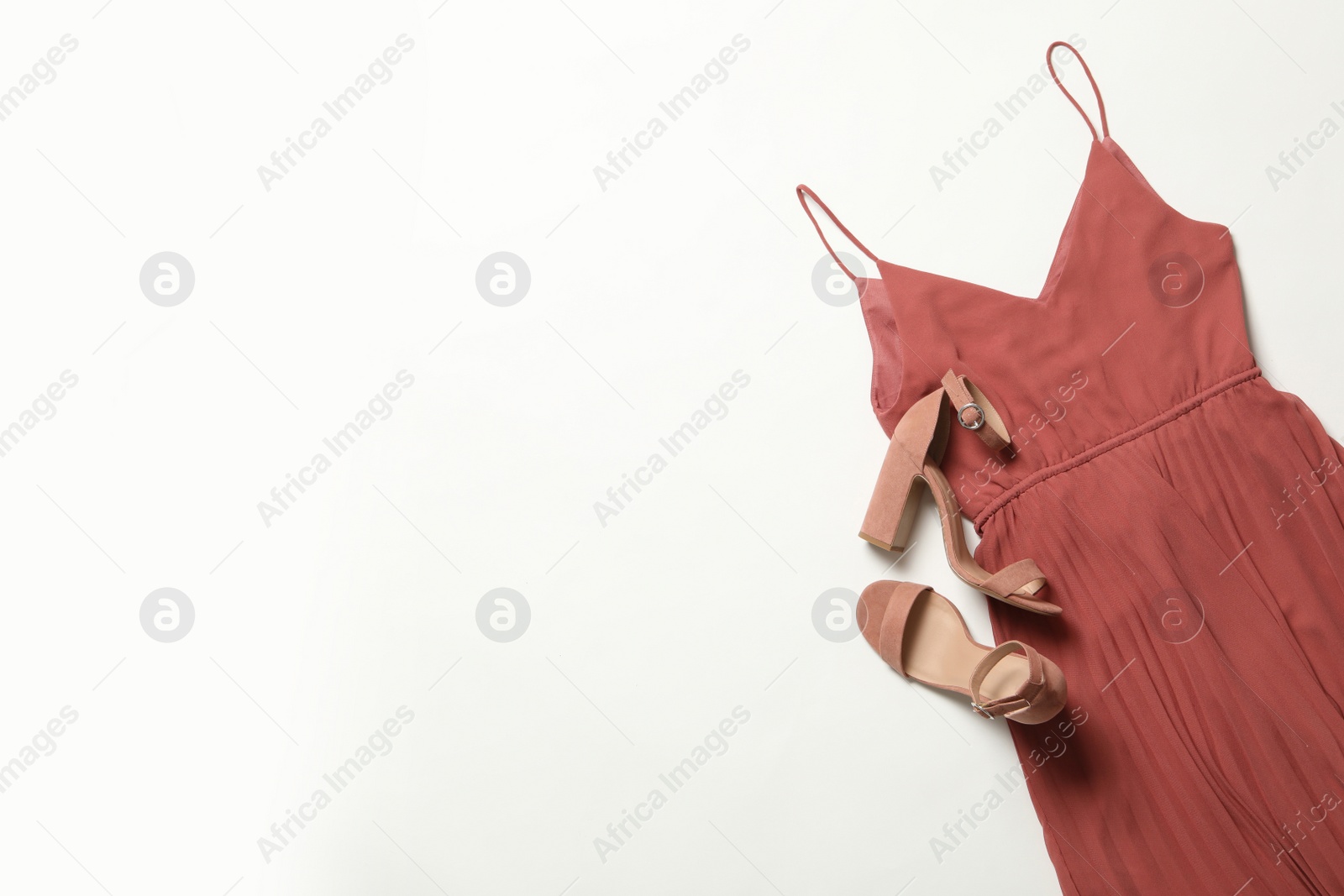 Photo of Stylish coral dress and shoes on white background, flat lay. Space for text