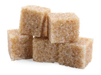 Photo of Many brown sugar cubes isolated on white