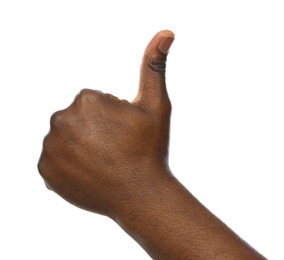 Photo of African-American man showing thumb up gesture on white background, closeup