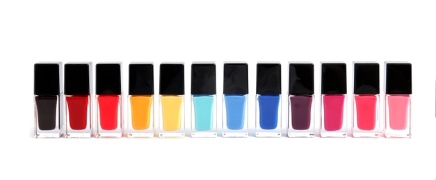 Bottles of nail polish on white background