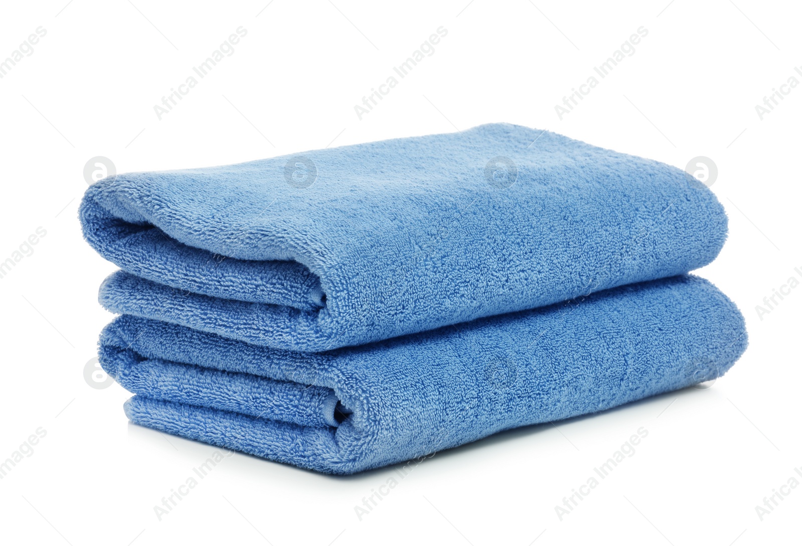 Photo of Clean color folded towels on white background