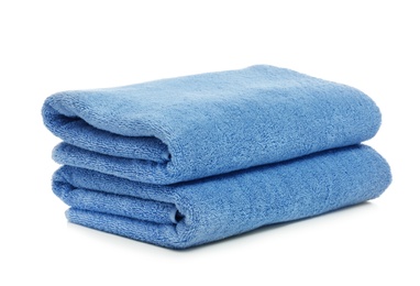 Photo of Clean color folded towels on white background