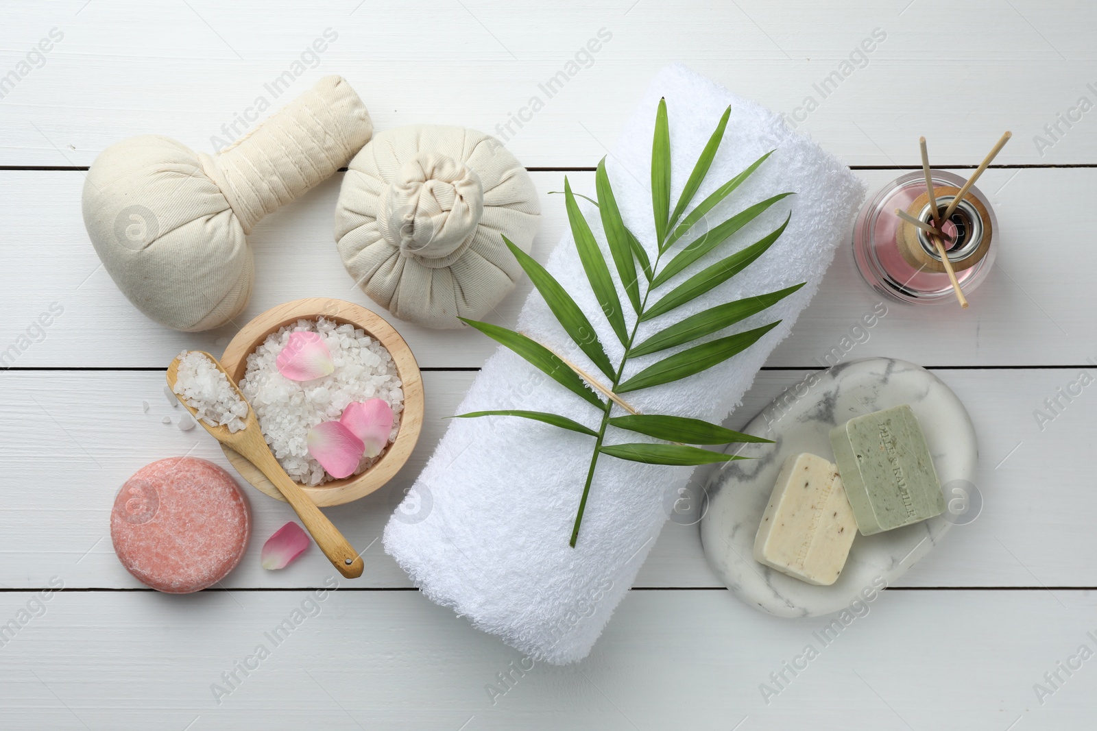 Photo of Flat lay composition with different spa products on white wooden table