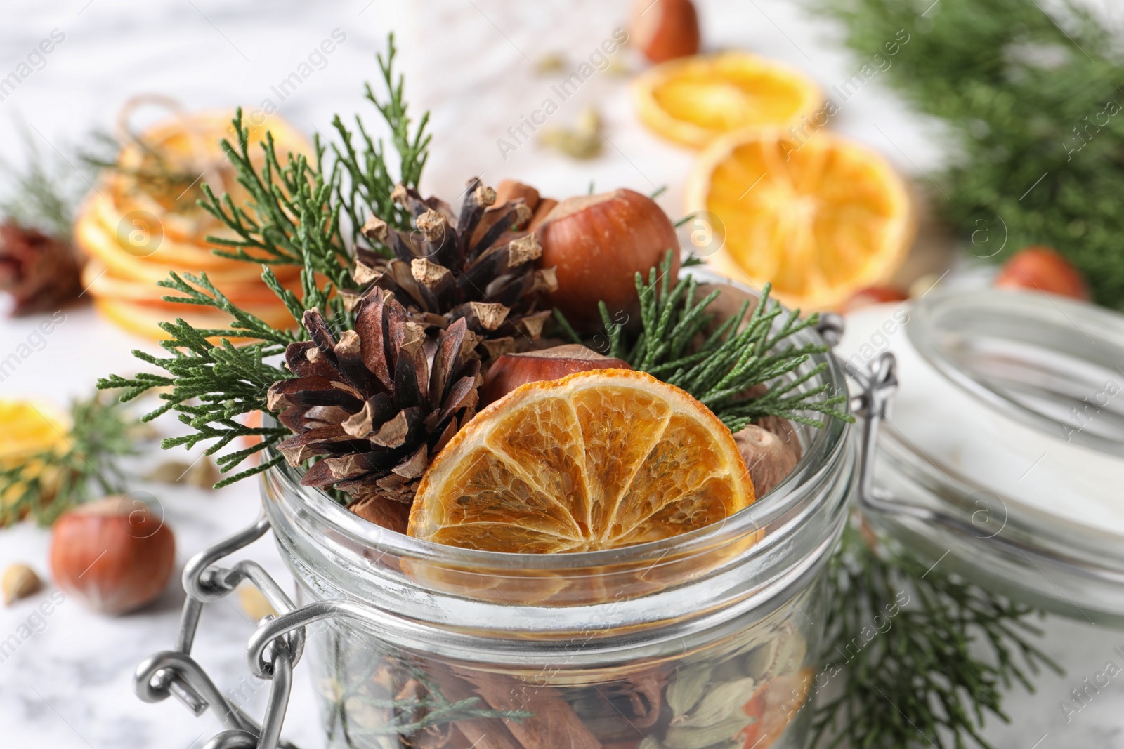 Photo of Aroma potpourri with different spices in jar, closeup view