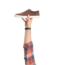 Photo of Man holding stylish shoe on white background, closeup