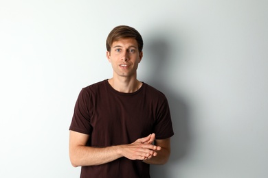 Portrait of handsome man on light background