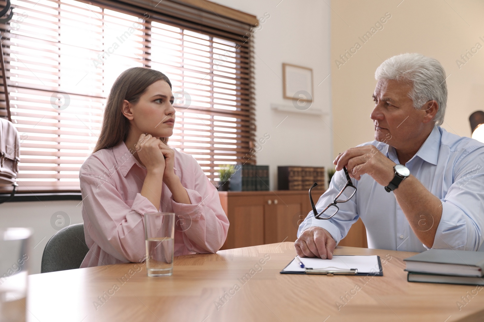 Photo of Professional psychotherapist working with patient in office