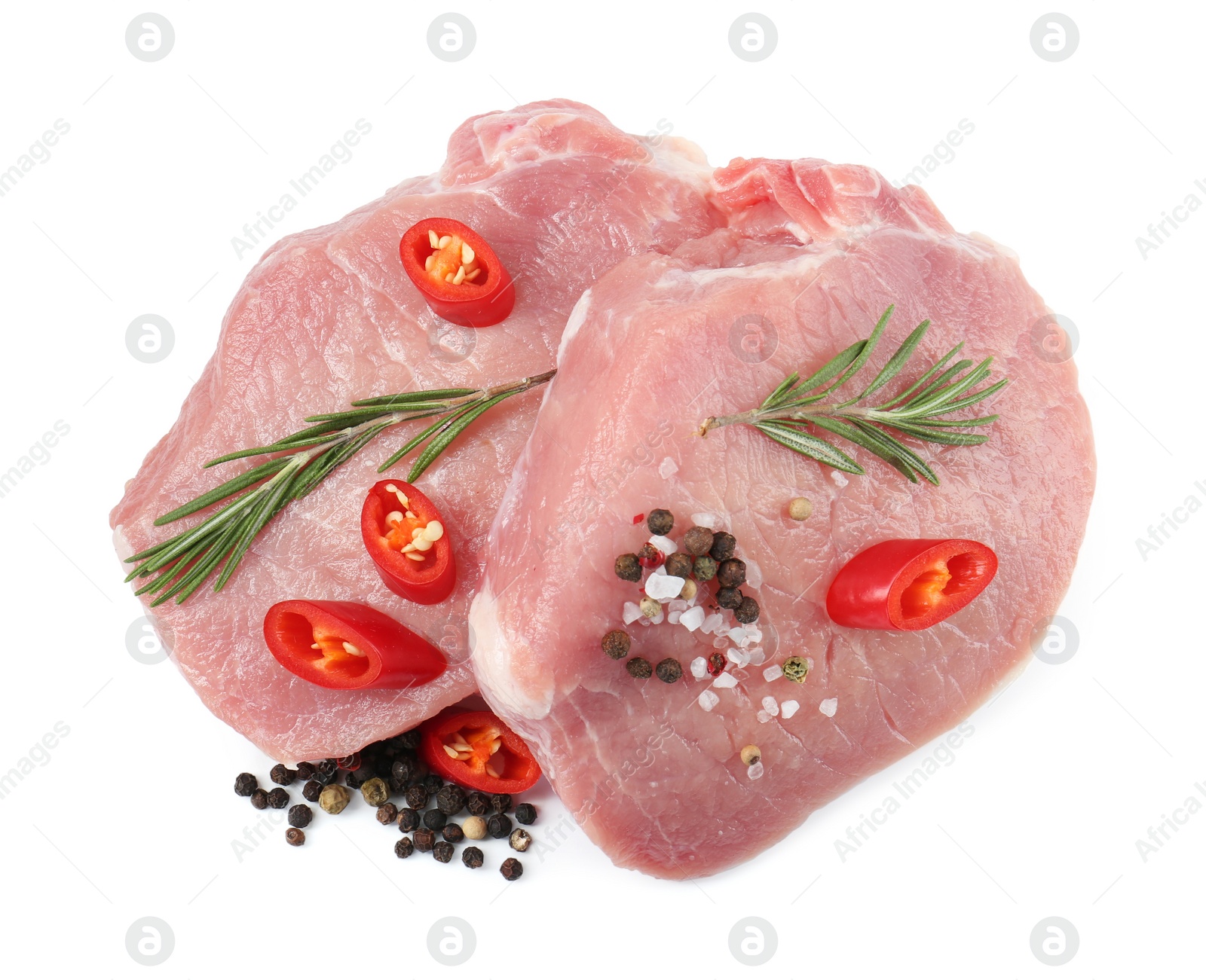 Photo of Pieces of raw pork meat and spices isolated on white, top view