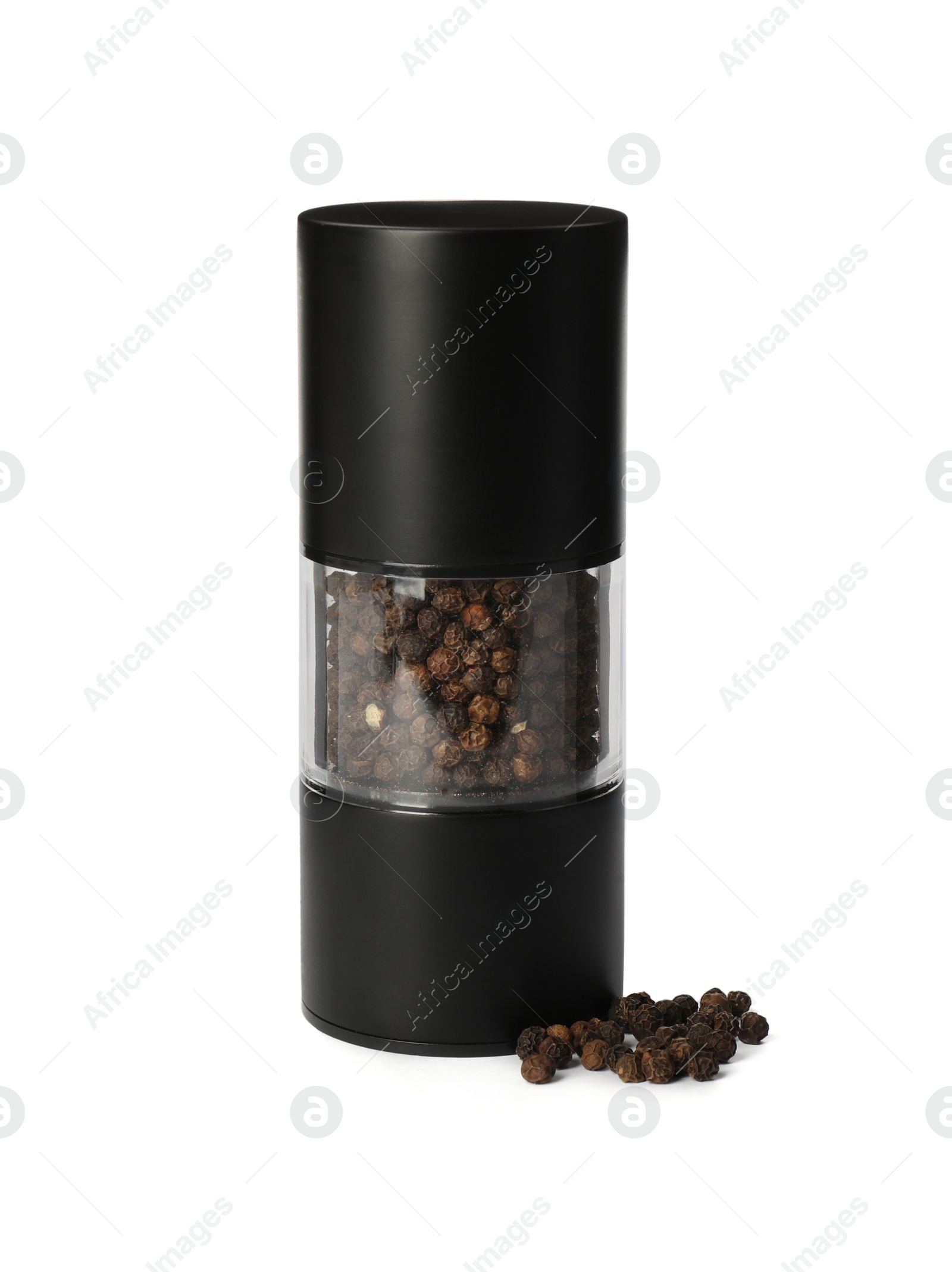 Photo of Pepper shaker isolated on white. Spice mill