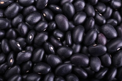 Photo of Many raw black beans as background, closeup