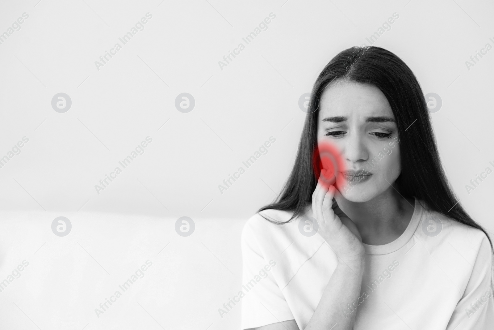 Image of Young woman suffering from toothache at home. Space for text