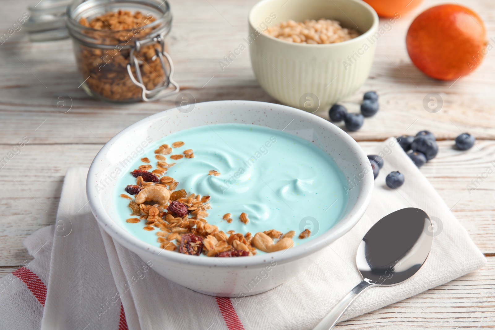 Photo of Bowl of spirulina smoothie served for breakfast on table