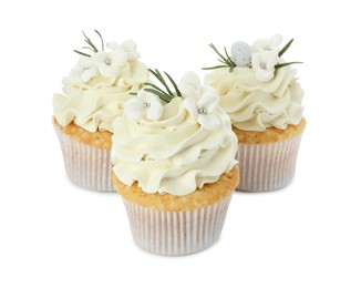 Tasty Easter cupcakes with vanilla cream isolated on white