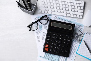 Tax accounting. Flat lay composition with calculator and documents on light grey table. Space for text