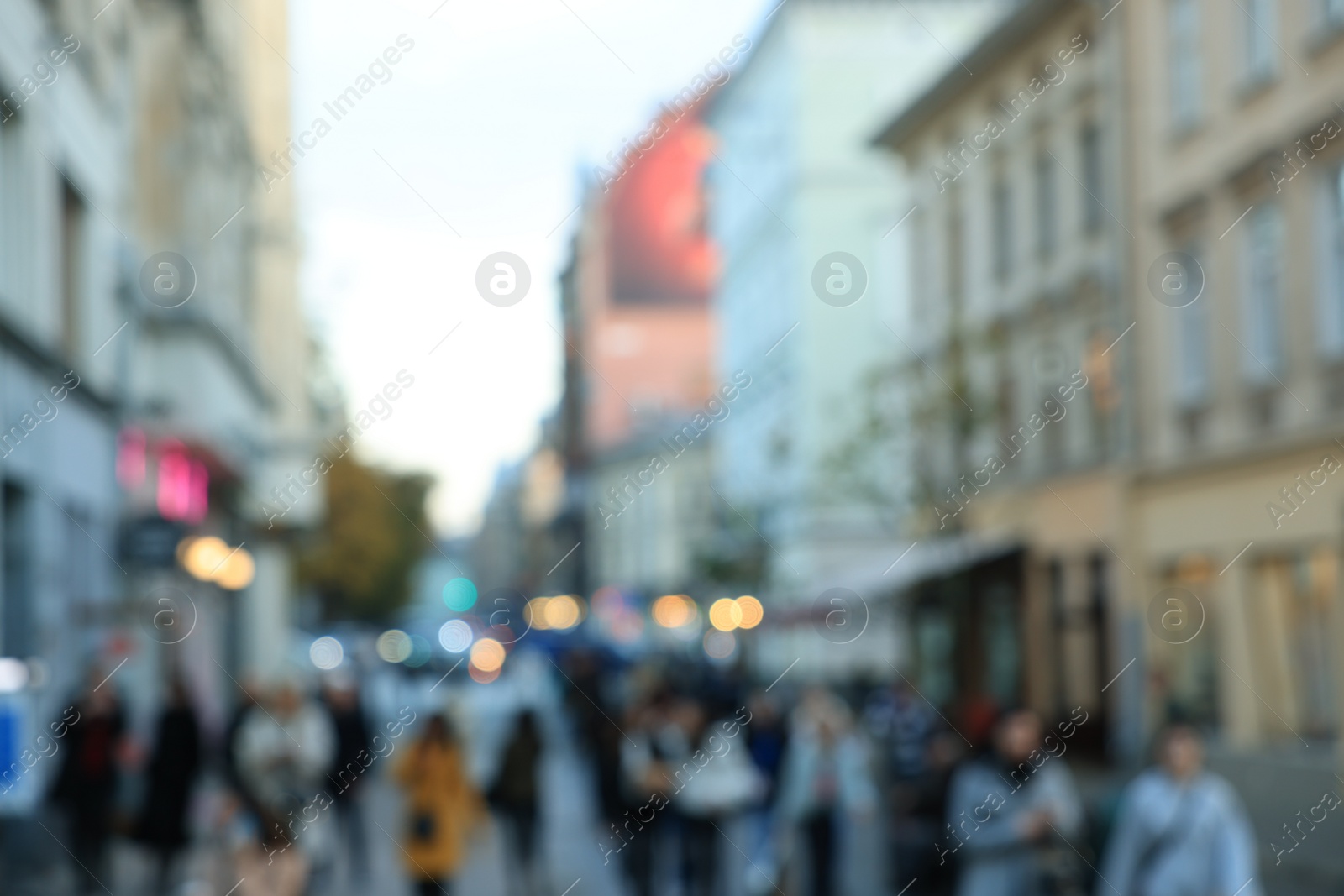 Photo of Blurred view of people walking on city street