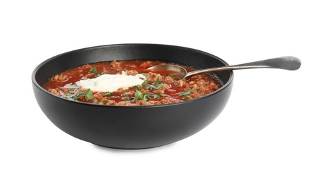 Bowl of delicious stuffed pepper soup on white background