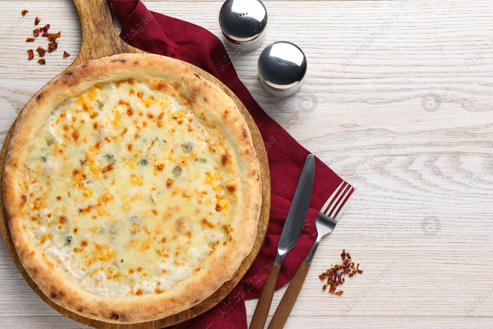 Photo of Delicious cheese pizza served on white wooden table, flat lay. Space for text