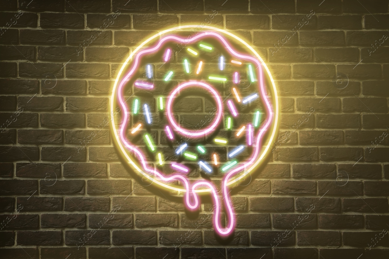 Image of Doughnut glowing neon sign on brick wall