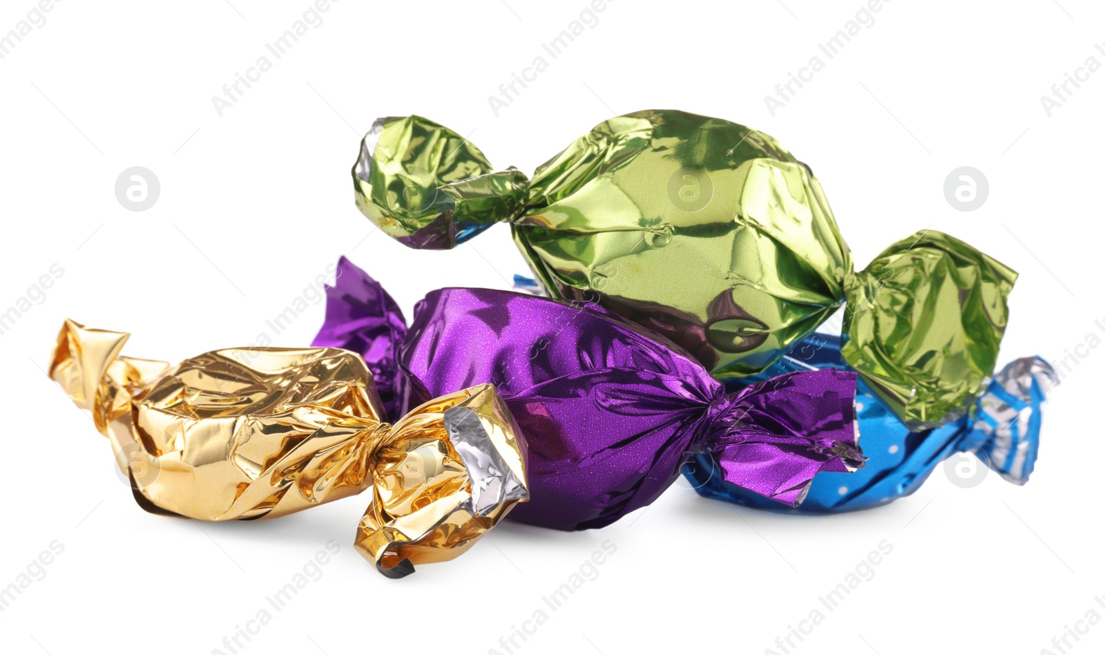 Photo of Candies in colorful wrappers isolated on white